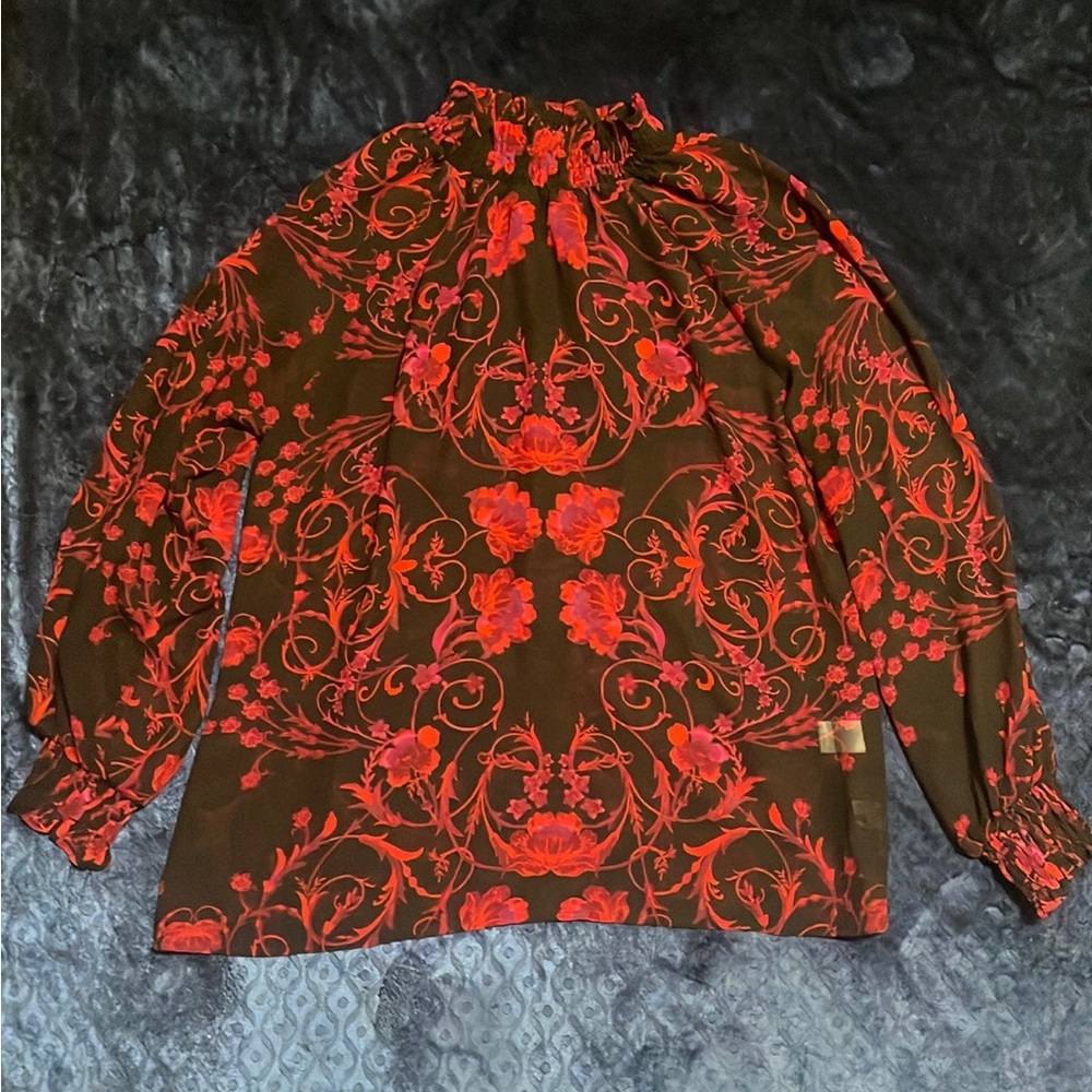 Eva Mendes red and black sheer blouse